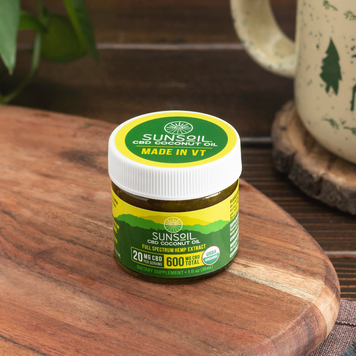 Sunsoil Coconut Oil on a wooden table.